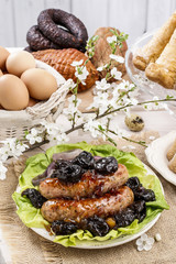 Sausage with plums and onion