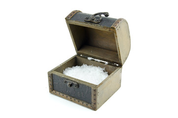 open chest box with artificial snow isolated on white background. copy space to the left