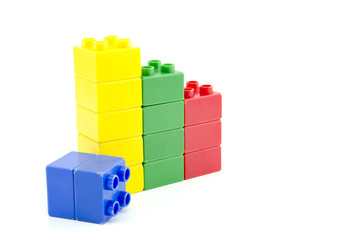 blue, yellow, green and red plastic building block isolated white background