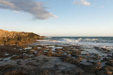 Rocky shore. Sunset over the sea