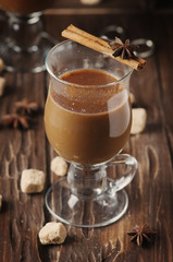 Hot american coffee with cinnamon on the vintage table