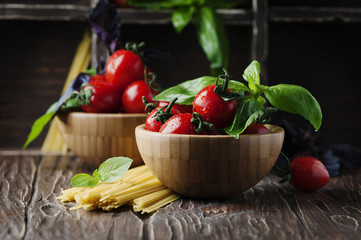 Concept of healthy eating with tomato, pasta and basil