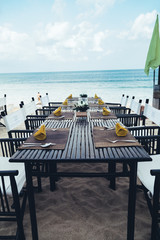 Served table at the sea shore on tropical beach