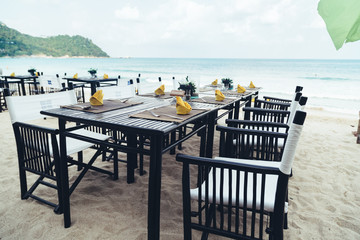 Served table at the sea shore on tropical beach