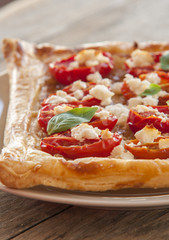 Tomato tart, puff pastry topped with mustard, cheese and cherry toamtoes.
