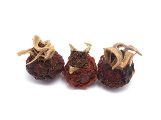 dried rose hips on a white background