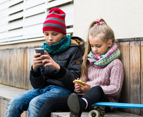 Children looking at smartphone