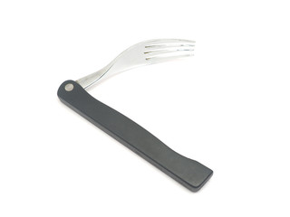 Folding travel fork on a white background