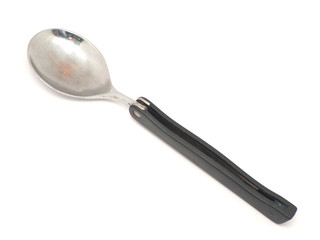 Folding travel spoon on a white background