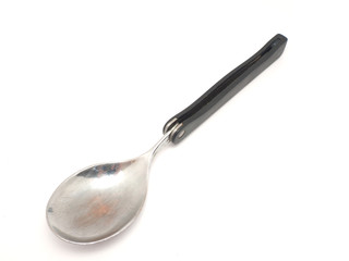 Folding travel spoon on a white background