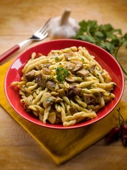 strozzapreti with mushroom, selective focus