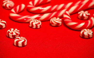 Red and white caramel candy on the red burlap