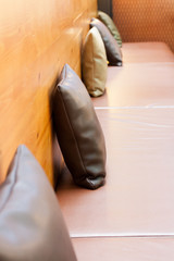 Brown leather pillow in restaurant.