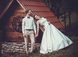 A young bride and groom standing together outdoor