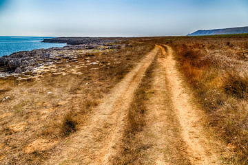red path on the rocky beach