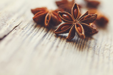 Spices. Anise stars on wooden surface