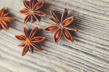 Spices. Anise stars on wooden surface
