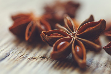Spices. Anise stars on wooden surface