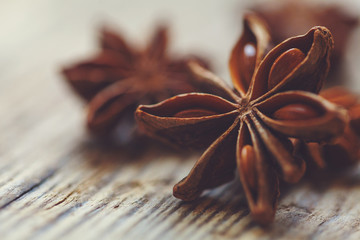 Spices. Anise stars on wooden surface