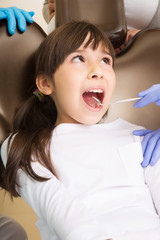 Little girl at the dentist