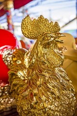 Beautiful golden cock rooster sculpture in a shrine,  joss house