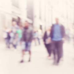 Blurred image of people in the city.