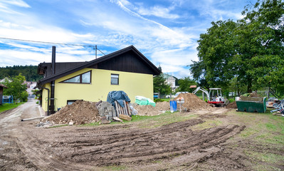 Rebuilding a house and adding an extension. Construction site - obrazy, fototapety, plakaty