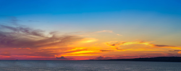Naklejka na ściany i meble Sunset panorama over sea