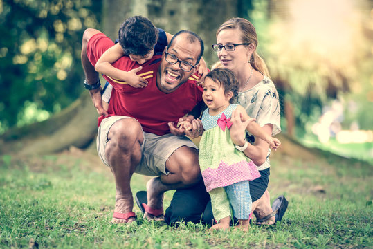 Happy Interracial Family Is Being Active A Day In The Park