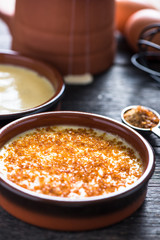 Creme brulee in rustic porcelain pot