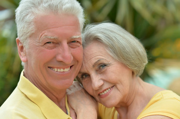 mature couple on  in summer park