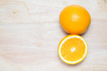  orange fruit on wooden background