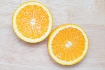 slice of orange fruit on wooden background