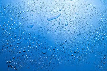 Water drop on blue background