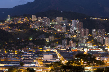 Aerial view of Medellin at night with residential and office buildings. Colombia