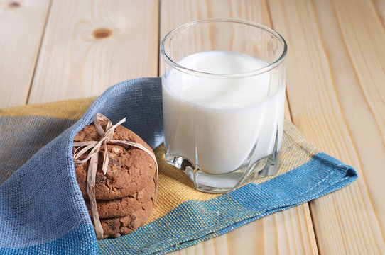 Glass with milk and cookies