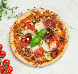 Delicious italian pizza served on wooden table