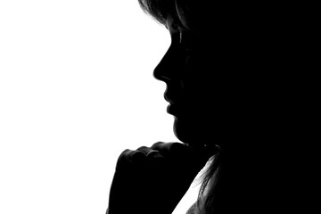 silhouette of a woman's face on a white background