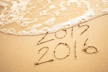 2016 text on the beach for new year concept background

