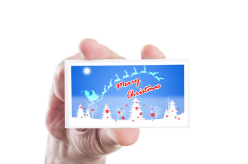 Hand holding merry Christmas greeting card