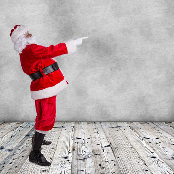 Santa Claus posing  on wooden background