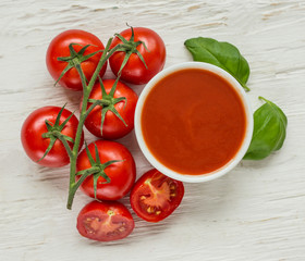 Bowl of tomato sauce with fresh ingredients