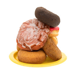 Stacked donuts and fritter on a yellow plate