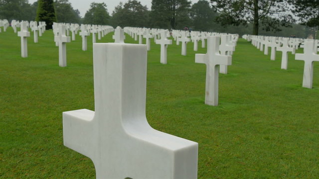 One of the many crosses on the cemetery in Normandy. The Normandy American Cemetery and Memorial is a World War II cemetery and memorial in Colleville-sur-Mer Normandy France  
