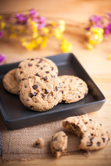 Chocolate chip cookies in black ceramic dish