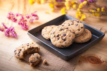 Chocolate chip cookies in black ceramic dish