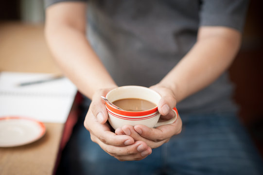 Coffee cup in male hand