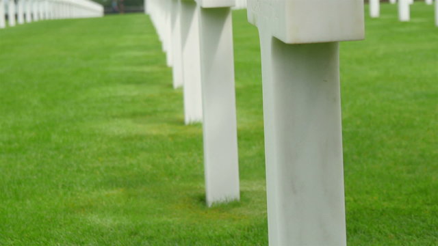 Closer look of the white tomb with the flaglet. The flaglet is the American flag on the ground