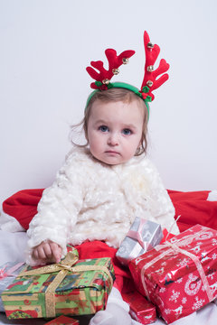 baby with chrismas presents 