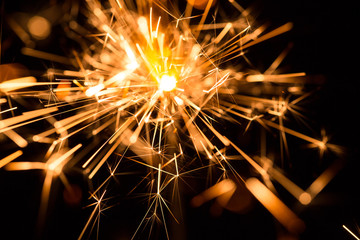 Christmas and New Year party sparkler on black
